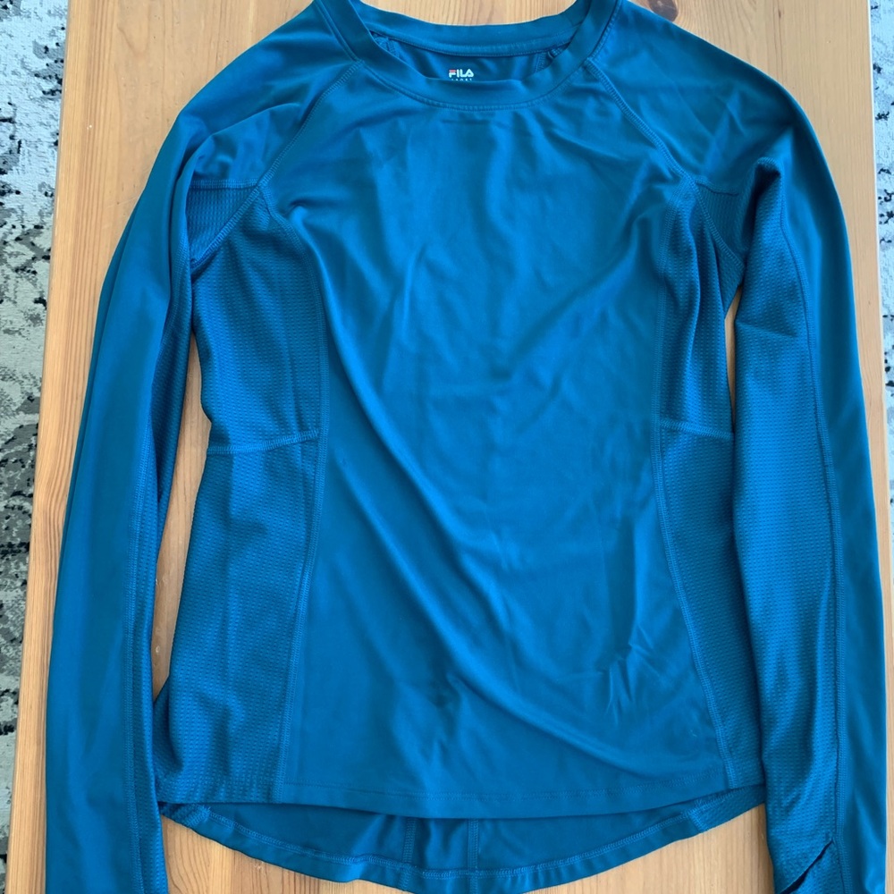 Long sleeve workout top with thumb holes. flattering fit and great for layering